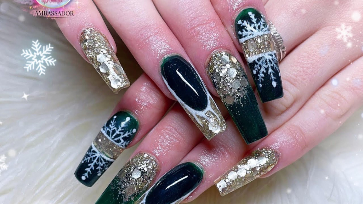 Christmas dark green and gold acrylic nails with hand painted snowflakes  using all @glitterbels