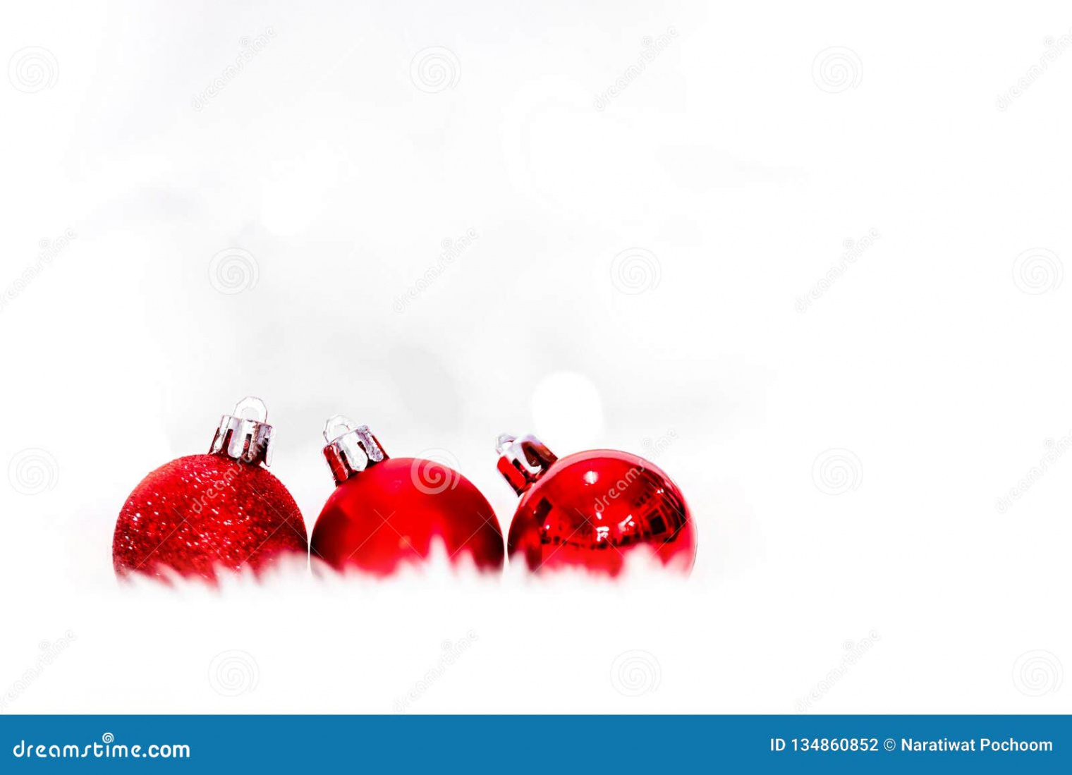 Red Christmas Balls on White Snow on Light Background , New Year