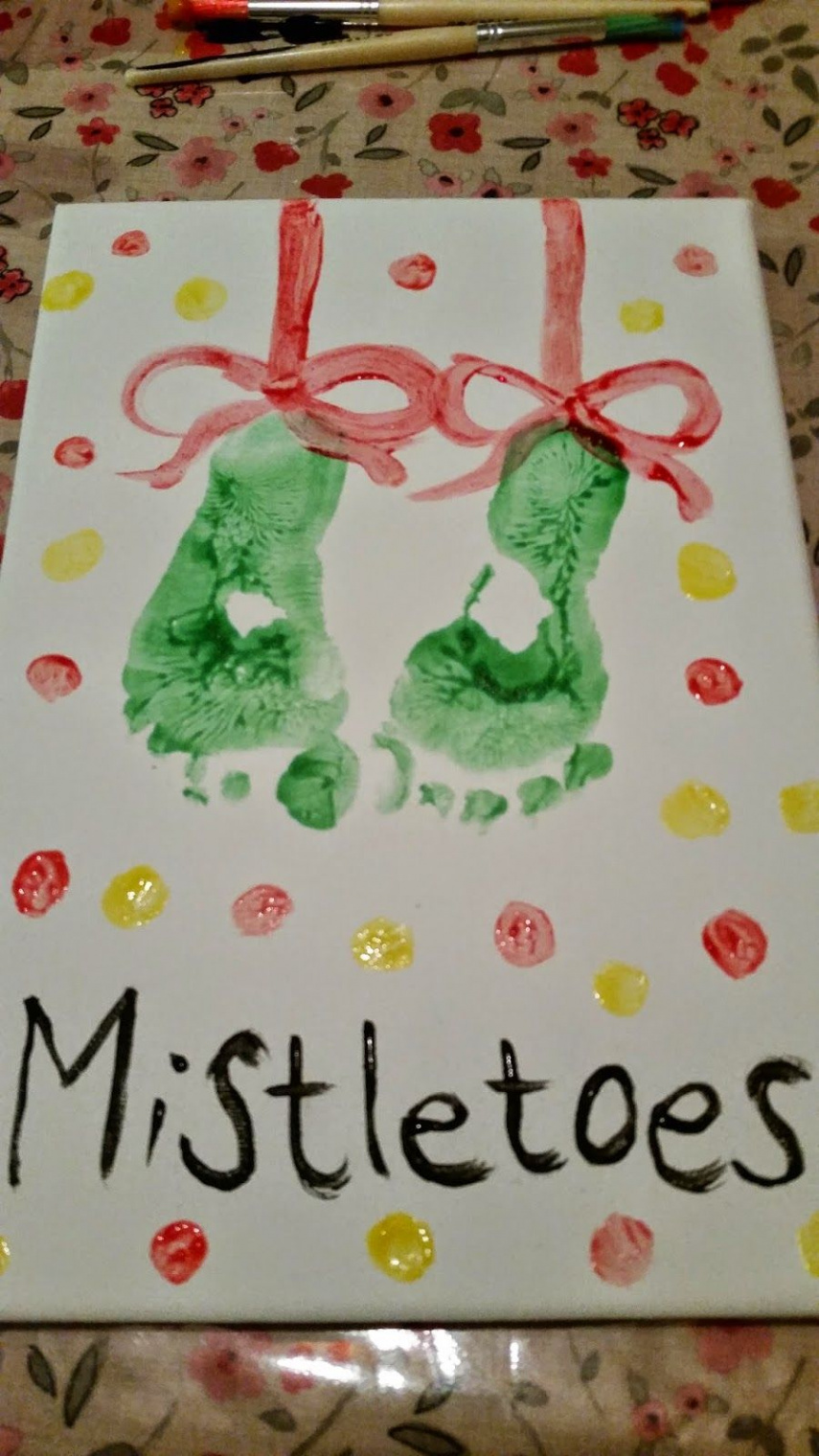 A homemade christmas canvas gift from babies and toddlers