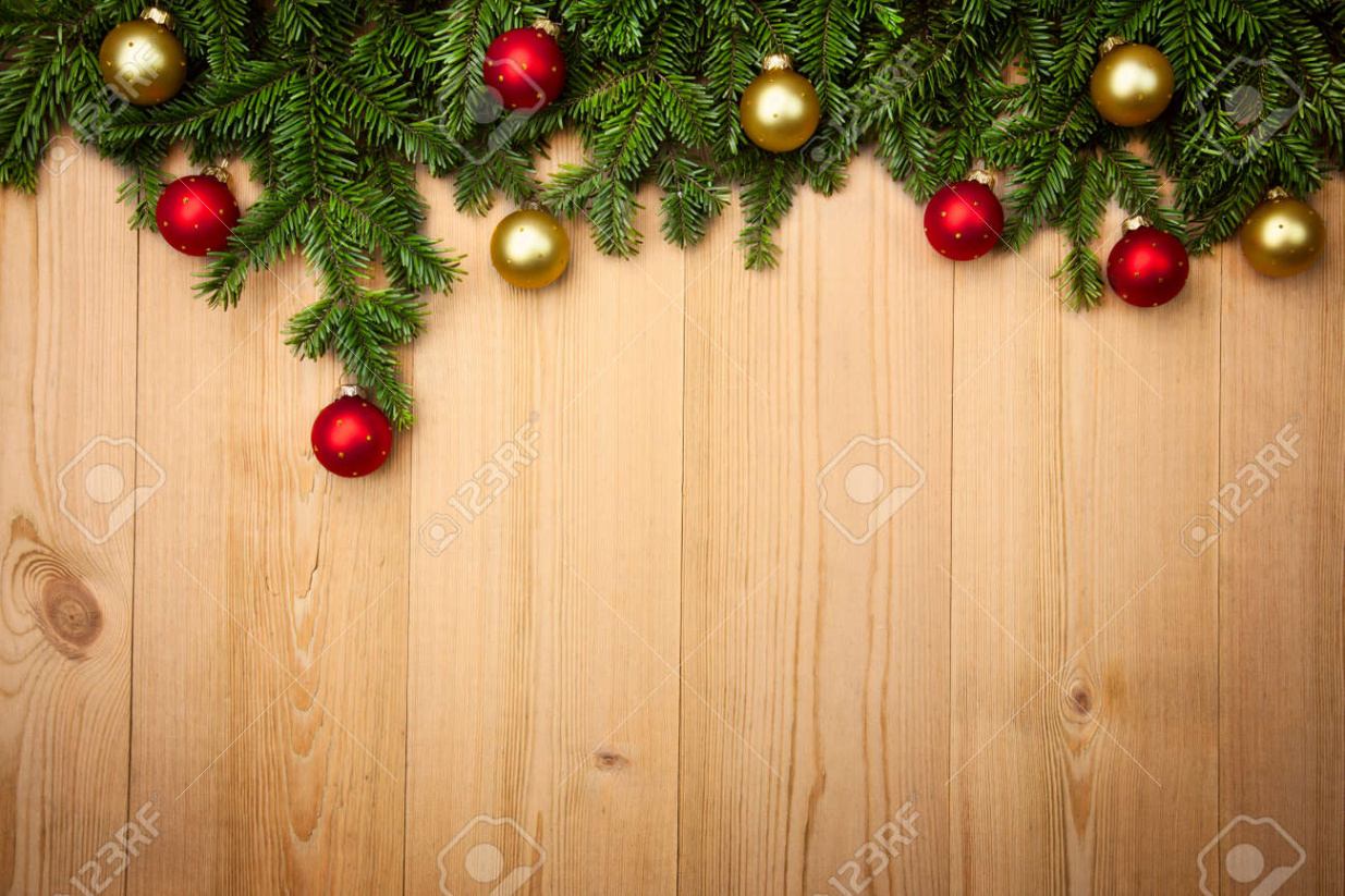 Christmas Background With Fresh Firtree And Baubles On Wood