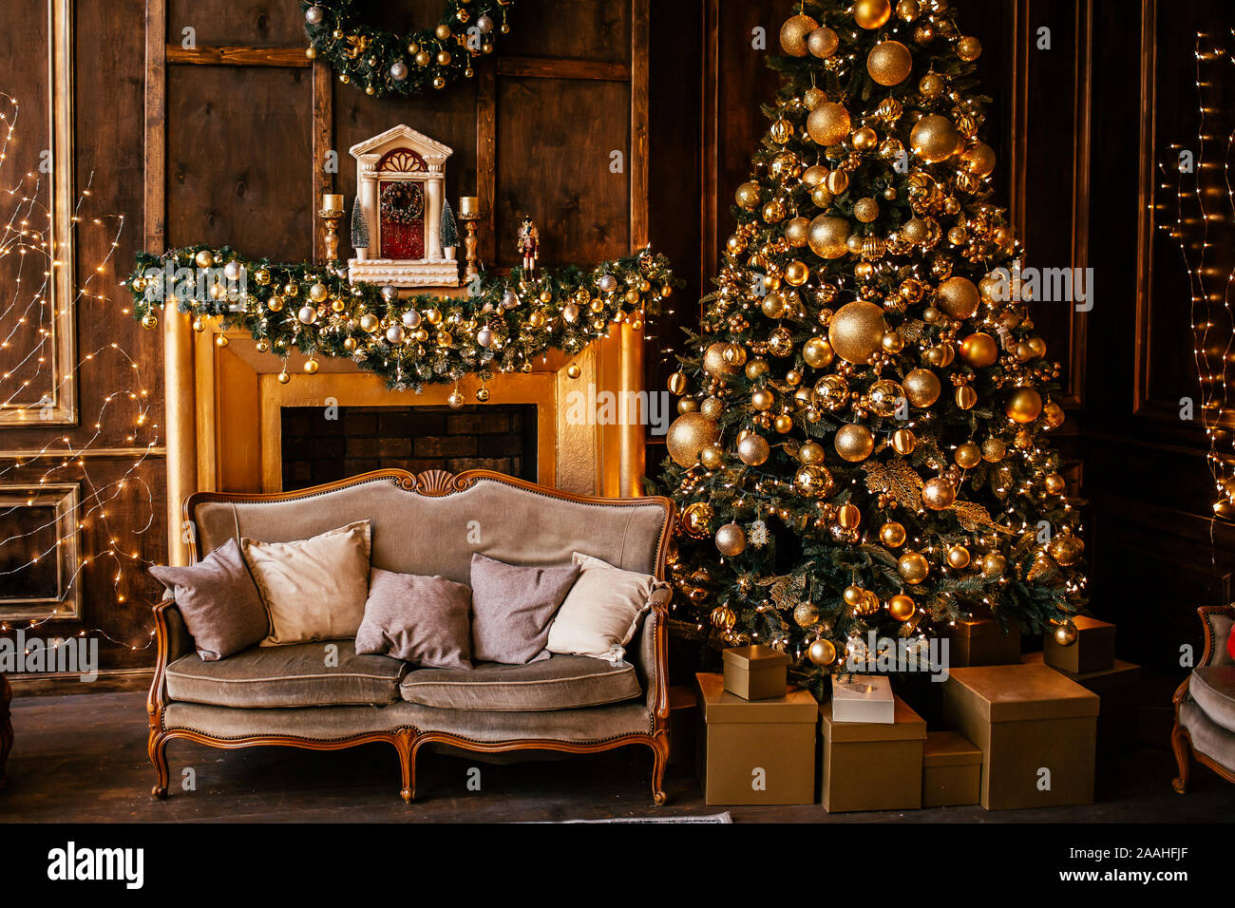 Christmas background with illuminated fir tree with golden