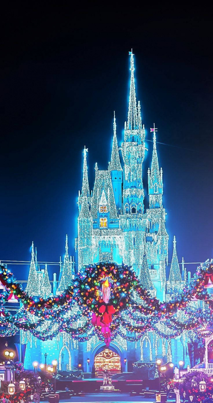 Download Disney Christmas Castle With Blue Lights Wallpaper