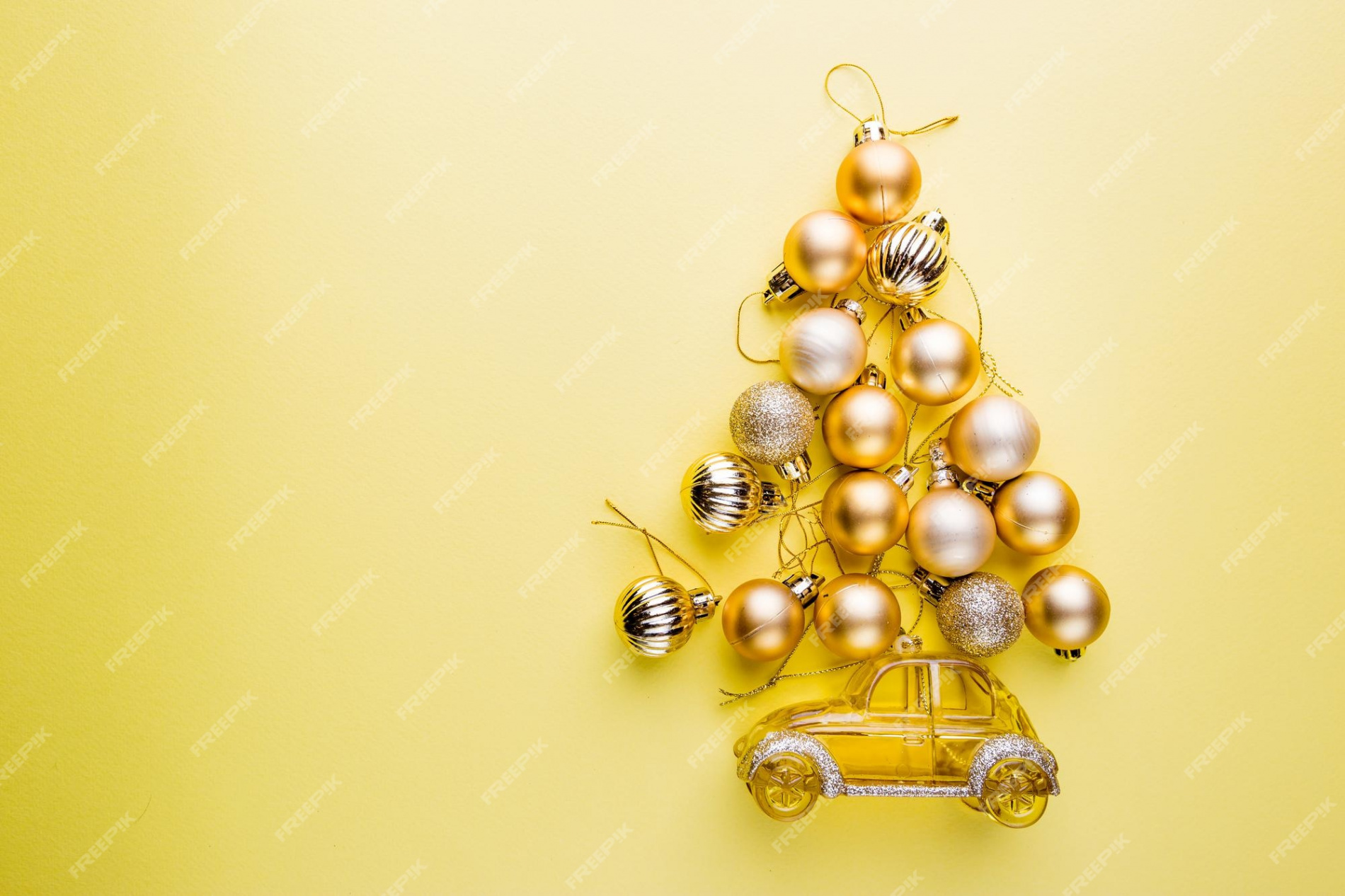 Premium Photo  Christmas tree made of christmas balls on yellow
