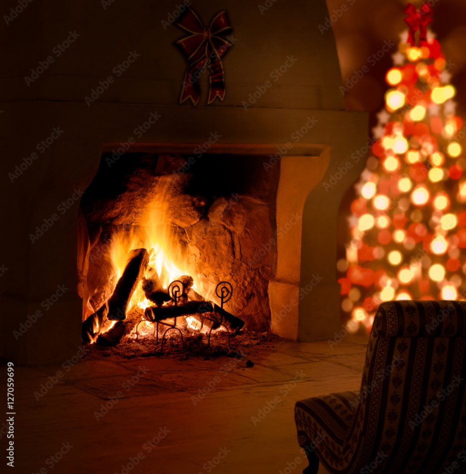 Christmas tree near fireplace